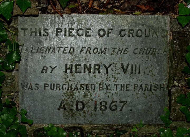 Plaque concerning church land taken by Henry VIII on the Dissolution of the Monasteries