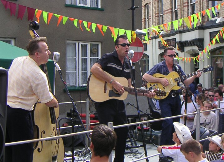 Rock 'n' Roll Band the Dime$tore Gamblers plays Pilton Festival in July 2005